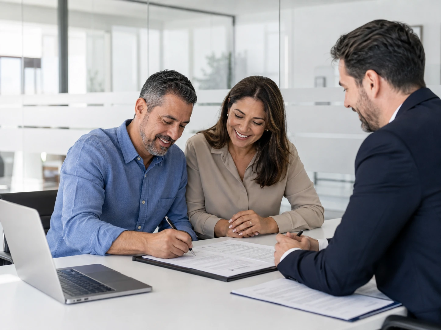 Couple Signing Real Estate Contract With Agent